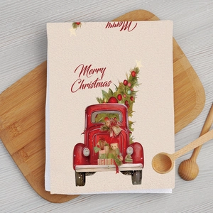 Detail of Christmas microfiber kitchen towel with red truck carrying tree and gifts