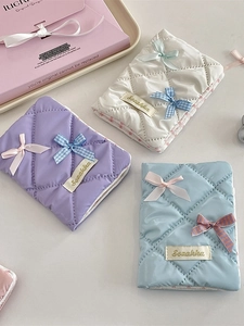 Quilted ribbon bow passport holder and document organizer in assorted pastel satin colors