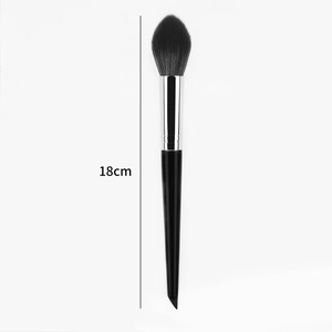 Detail showing the 18cm tapered handle and soft black bristles of the makeup brush