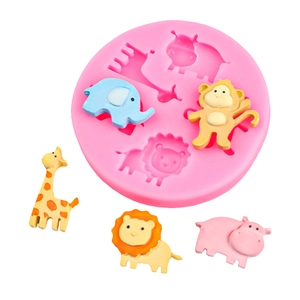 Pink silicone mold for cartoon animals like lion and elephant with finished colorful figures