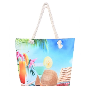 Détail du sac de plage avec imprimés tropicaux et poignées épaisses en corde de coton blanc