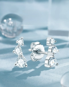 Macro view of S925 sterling silver shooting star stud earrings with moissanite stones