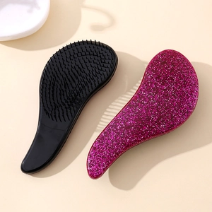 Portable anti-static hairbrushes in black and glitter rose red with ergonomic handles