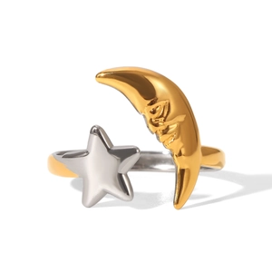 Macro view of 18K gold moon and silver star contrast details on adjustable open ring