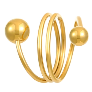 Macro shot of gold spherical spiral ring with polished finish on a white background