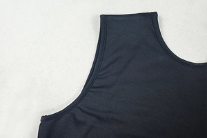 Detail of crew neck and shoulder seam on black mesh slim fit bodysuit for women