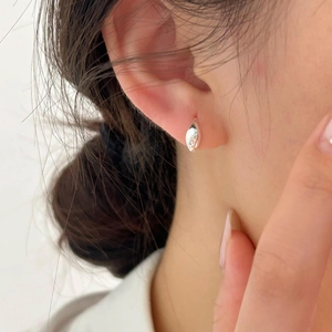 Minimalist 925 sterling silver water drop earrings shown on model for a side view look