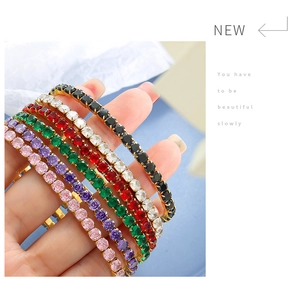 Close-up of 18K gold plated tennis bracelets with colorful zircon stones on a hand