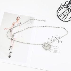 Detail of silver sunflower waist chain with square links and adjustable lobster clasp closure