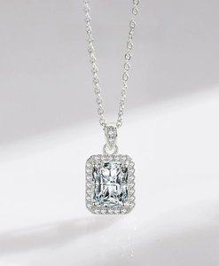 Macro view of 925 sterling silver necklace with halo radiant cut zircon pendant