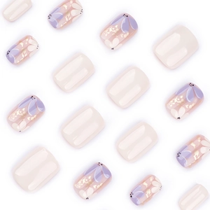 Short square press-on nails with sweet floral art, gold foil, and cream white glossy finish