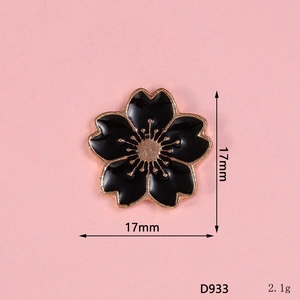 Detail view of a 17mm black enamel cherry blossom charm with gold frame and dimensions