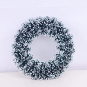 Classic green Christmas wreath with snowy white tips for festive holiday wall decoration