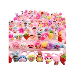 Pink cartoon rings for kids with strawberry and ice cream resin designs in bulk set