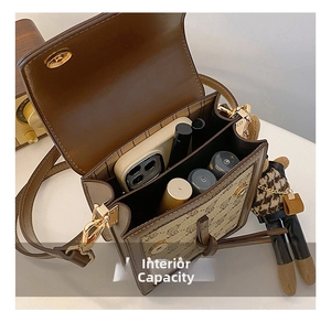 Internal capacity of vintage canvas shoulder bag showing phone and lipstick slots