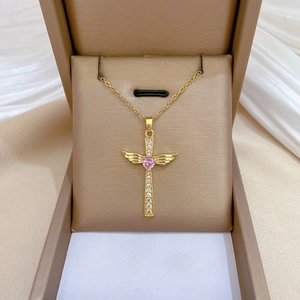 Luxurious gold titanium steel cross necklace with wings and pink heart stone in a gift box