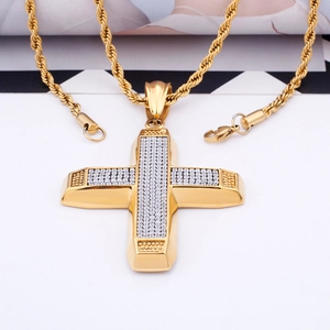 Close-up of hip hop cross pendant in 18K gold plating with sparkling clear stones