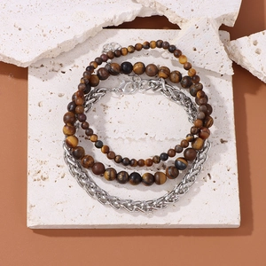 Detail of multi-layer bracelet set with natural stone beads and silver Cuban chain link