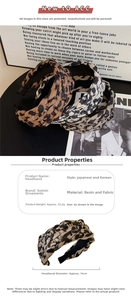 Detail showing 14cm diameter and 55.2g weight for a braided leopard print headband