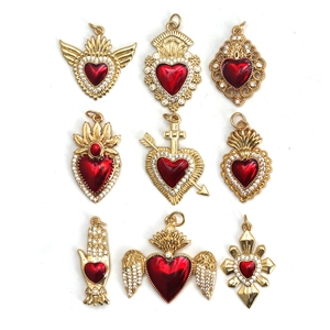 Nine red heart pendants with gold frames, rhinestones, and symbolic wings or crown motifs