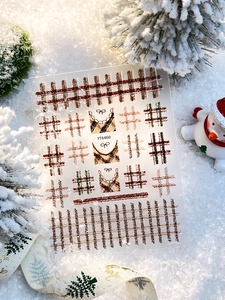 Detailed view of YT6460 Christmas plaid nail stickers with bows on a snowy background