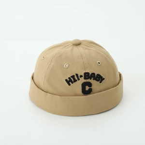 Detail of khaki cotton baby beanie featuring black HI!-BABY C letter embroidery