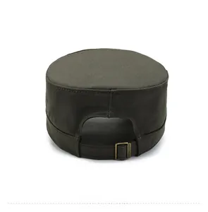 Detail view of adjustable bronze metal buckle on army green canvas military flat top cap