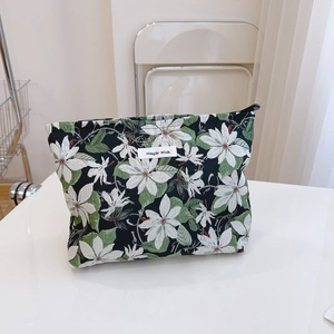 Floral jacquard handbag with green leaves and zipper, modern minimalist aesthetic style