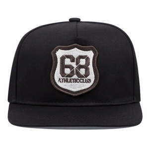 Close-up of black hip hop cap with detailed 68 Athletic Club shield embroidery