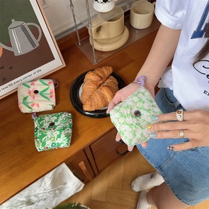 Floral mini sanitary storage pouch with button closure and purple carry loop
