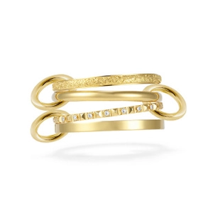 Detailed view of multilayer gold-plated snake ring with matte and studded textures