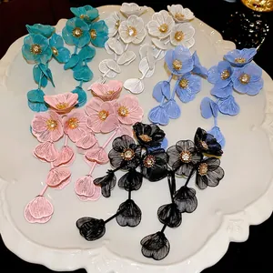 Floral tassel drop earrings with sparkling crystal centers in multiple vibrant colors