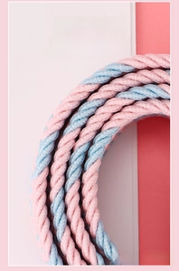 Detail of pink and blue woven elastic belt showing high elasticity and durable texture