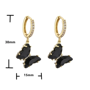 Detailed view of gold crystal butterfly hoop earrings with dimensions 38mm and 15mm