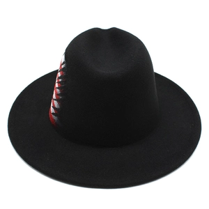 Detail view of black wool fedora featuring a red and white shark tooth graphic design
