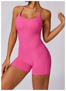 Close-up of rose pink athletic bodysuit showing thin straps and sleek U-neckline detail
