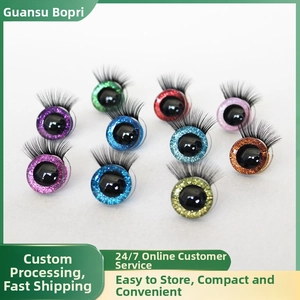 Macro detail of 3D colorful doll eyes with glitter resin finish and long black eyelashes