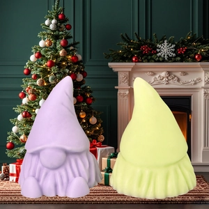 Christmas gnome scented candles in purple and yellow colors for festive holiday home decor
