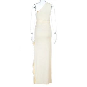 Detail of off-white one-shoulder long dress featuring ruffled side and ribbed fabric