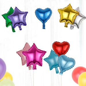 Star and heart shaped foil balloons in various metallic colors for party decorations