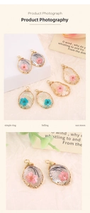 Detail of oval and teardrop resin pendants with dried flowers and gold wire wrap