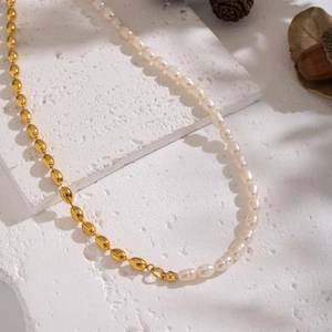 Vintage style necklace featuring natural freshwater pearls and golden oval metal beads