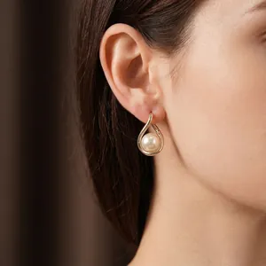 French vintage gold twisted pearl drop earrings for women with a minimalist luxury style