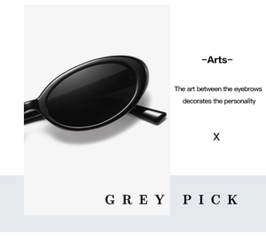 Detail view of glossy black oval sunglasses featuring vintage minimalist frame and lenses
