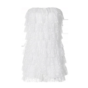 Detail of white layered lace tube dress with tiered skirt and floral mesh texture
