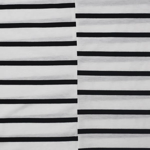 Close-up of black and white striped fabric texture with detailed stitching and seams