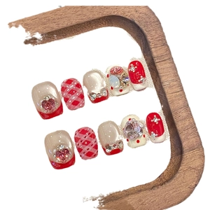 Pink and red plaid press-on nails with bowknot charms and heart-shaped crystals