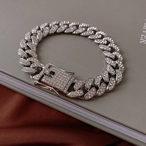 Close-up of iced-out Cuban link bracelet with sparkling rhinestones and secure clasp