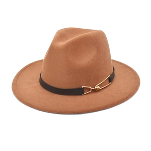 Detail of wool fedora hat featuring a black leather band and gold metal buckle pin