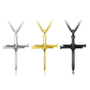 Three punk style nail cross pendants in silver, gold, and black colors on chains